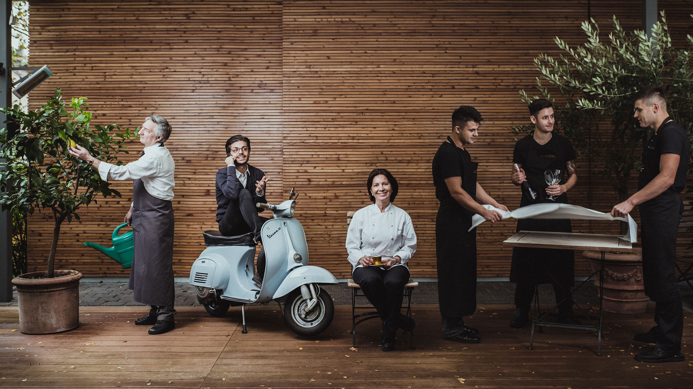image of the nannina team on their terasse in the style of anne Leibowitz taking by Tim Cavadini